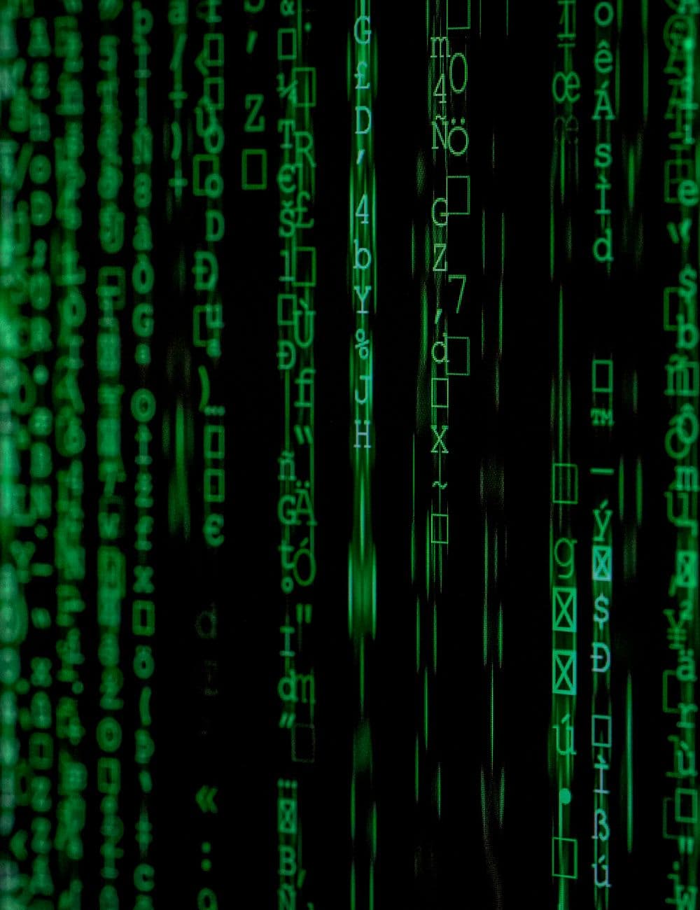 Streams of code glowing on a dark screen